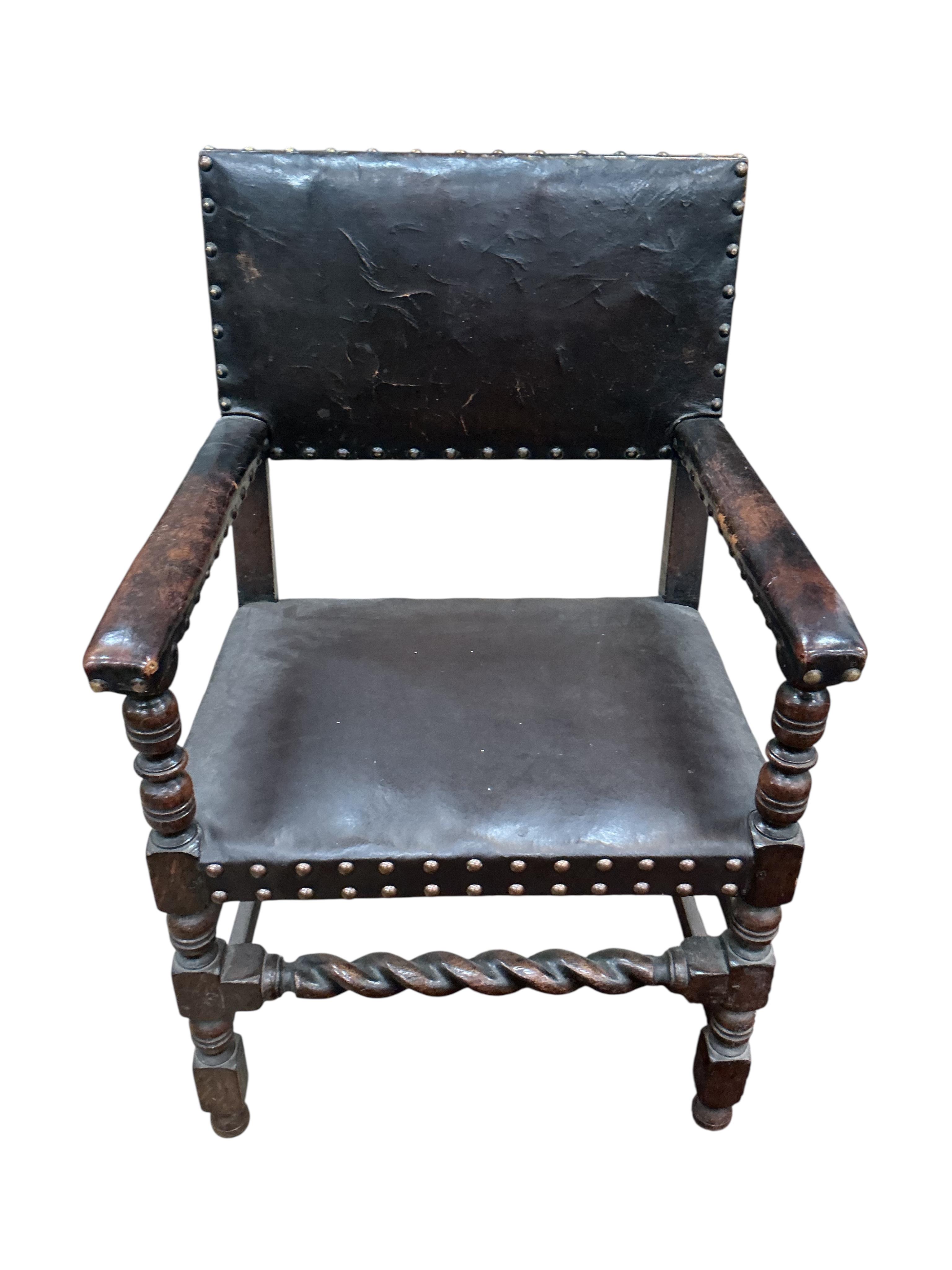 A set of eight Tudor style oak dining chairs, two with arms